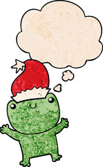 cute cartoon frog wearing christmas hat with thought bubble in grunge texture style