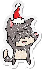 happy hand drawn distressed sticker cartoon of a fox wearing santa hat