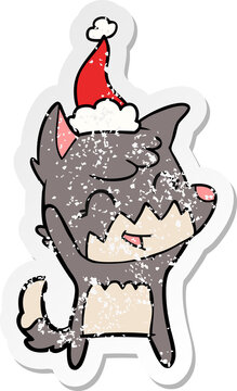 happy hand drawn distressed sticker cartoon of a fox wearing santa hat