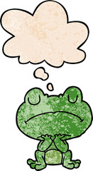 cartoon frog with thought bubble in grunge texture style