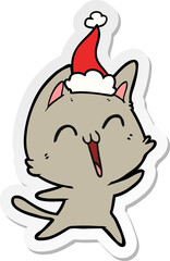 happy hand drawn sticker cartoon of a cat wearing santa hat