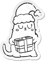 distressed sticker of a cute cartoon christmas cat