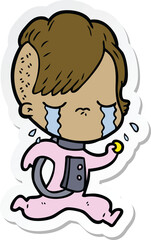 sticker of a cartoon crying girl