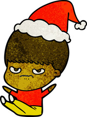 hand drawn textured cartoon of a boy wearing santa hat