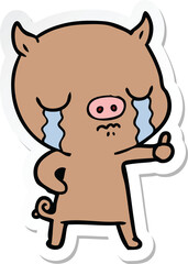 sticker of a cartoon pig crying