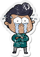 distressed sticker of a cartoon crying man with crossed arms
