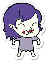 sticker of a cartoon vampire girl with blood on cheek