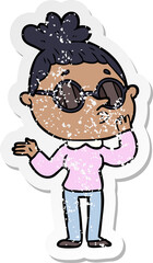distressed sticker of a cartoon woman wearing sunglasses