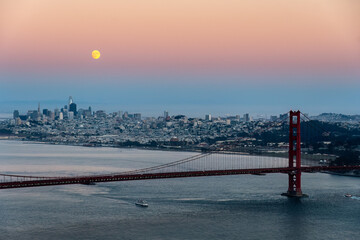 San Francisco skyline with full moon at sunset.