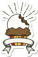 sticker of a tattoo style cupcake with missing bite