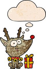 cartoon christmas reindeer with thought bubble in grunge texture style