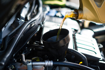 Pouring engine oil