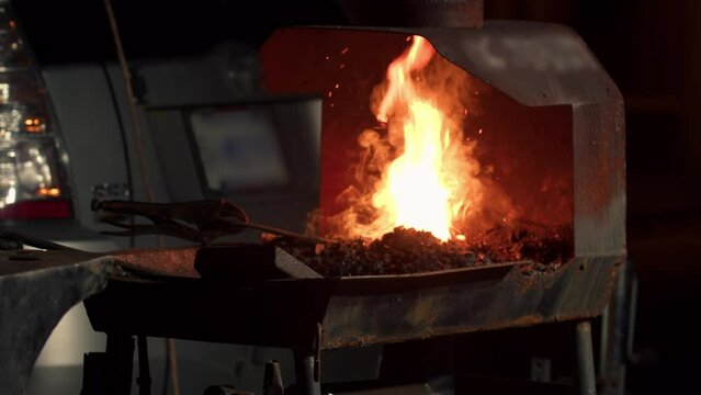 Fire in a Blacksmith's Furnace in a Blacksmith's Workshop Close-up, Slow Motion.