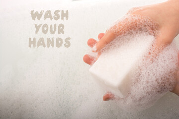 Child washing hands  in foam Stop COVID-19.