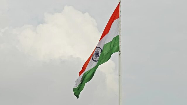indian flag swaying with clouds in the background daytime 4k 25p