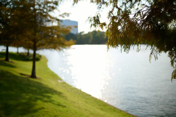 THE WOODLANDS, TEXAS - JULY 24th 2023: background settings for outdoor portraits by Lake Woodlands. The lake waters are tranquil, the fall colors are spectacular, there are hidden paths and benches