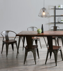 Interior of a Modern Nordic Dining Room Featuring an Industrial Black Metal and Wood Finish Kitchen...