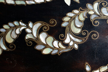 Delicate mother-of-pearl inlay embodies examples
