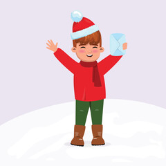 Boy wearing a red sweater, hat and scarf excited about Christmas and sending letter to Santa Claus