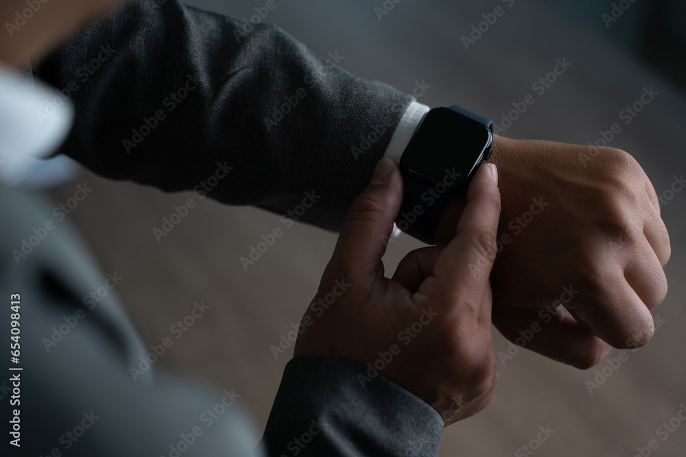 Poster man checking time on his smartwatch device close-up display clock checking lifestyle communication p
