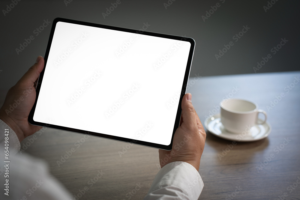 Poster digital tablet computer close up man using tablet hands man multitasking with isolated screen