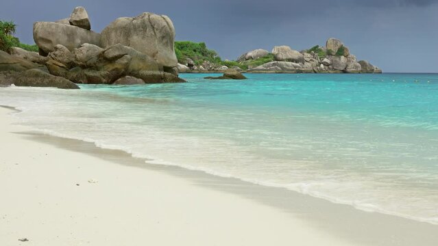 Landscape with white sand beach and storm sky on Similan islands, Thailand, 4k