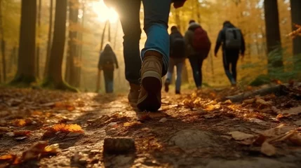 Rucksack Group of tourists walks along the path of the autumn forest © Thanos