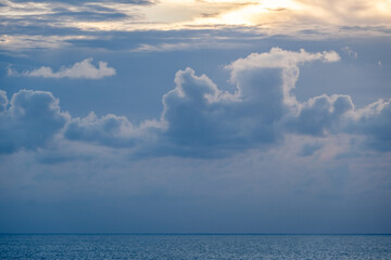 Blue-gray cloudy sky over the Caribbean Sea horizon