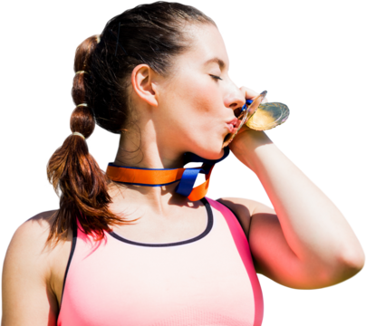 Digital png photo of happy caucasian sportswoman kissing medal on transparent background