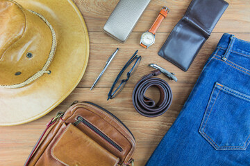Leather for men on wooden background./ Flat lay leather for men./ Leather and jeans for men.
