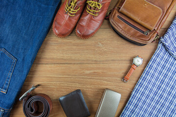 Leather for men on wooden background./ Flat lay leather for men./ Leather and jeans for men.