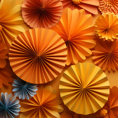 A natural orange background with fall colored folded pieces of paper decorating the edges, autumn colored paper quilling 