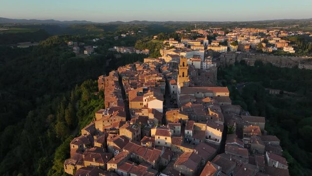 Pitigliano Cathedral, aerial view at sunset, historic medieval town in the province of Grosseto, Tuscany, Italy, push back reveal