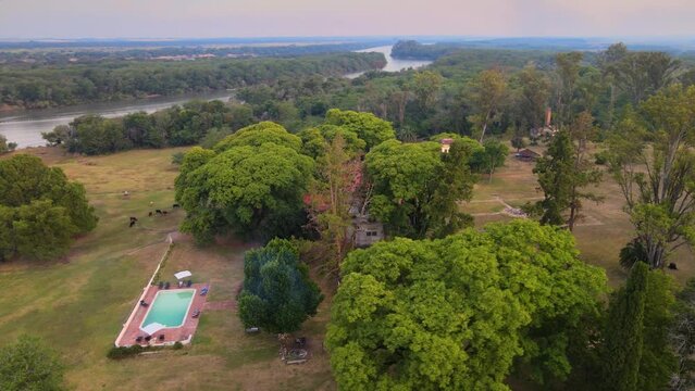 Drone shot flying around the estancia Santa C&aacute;ndida in Entre R&iacute;os, Argentina with the city of Concepci&oacute;n del Uruguay appearing in the background.