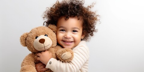 child hugs a bear doll on a white background, generative AI