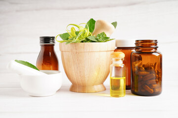 Alternative medicine herbal organic capsule with vitamin E omega 3 fish oil, mineral, drug with herbs leaf natural supplements for healthy good life.