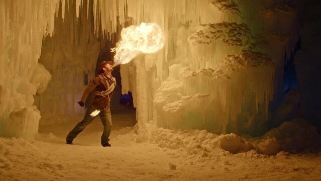 Fire Breather Lighting Up Frozen Structure In Slow Motion