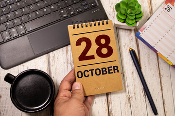 October 28th. Image of October 28 wooden color calendar on white background. Autumn day. Empty space for text