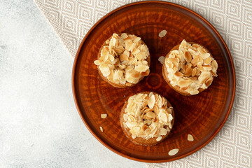 Tart pie with almond petals on plate