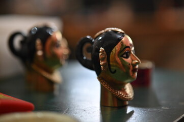 coloring of Goddess face. Hindu Goddess making statue. Face coloring proccess. Brush touch face....