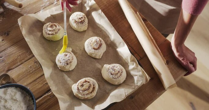 Slow Motion Top Down View on Delicious Buns Being Prepared to be Cooked for Evening Guests. Professional Female Chef Preparing Homemade Pastries Ordered by Clients Just in Time for Holidays