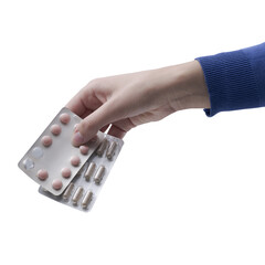 Hand holding blister packs of expired medicines