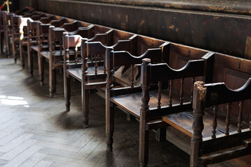 Rows of old church pews. Interior of an ancient church