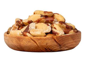 Brazil nut in wood bowl. Brazilian nuts peeled isolated on white background. Close up
