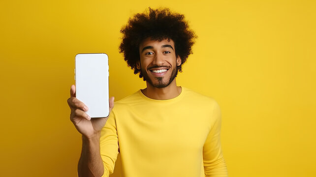 Happy Attractive African American Man Showing Blank Mobile Phone Screen Recommending App Smiling At Camera On Yellow Background. Mobile Application Advertising. AI.