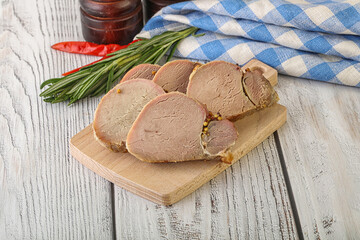 Baked pork tenderloin served rosemary