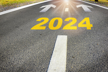 New year 2024 with arrow sign marking on road. Business recovery challenge concept and beginning success idea