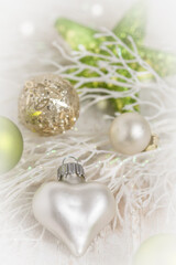Fototapeta na wymiar Christmas decoration with white heart and green colors