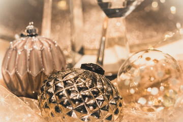 Close-up of Christmas baubles on a table decorated for Christmas, warm gold colors