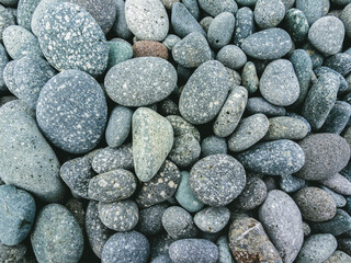 Pebbles stacked in the seaside. background.	